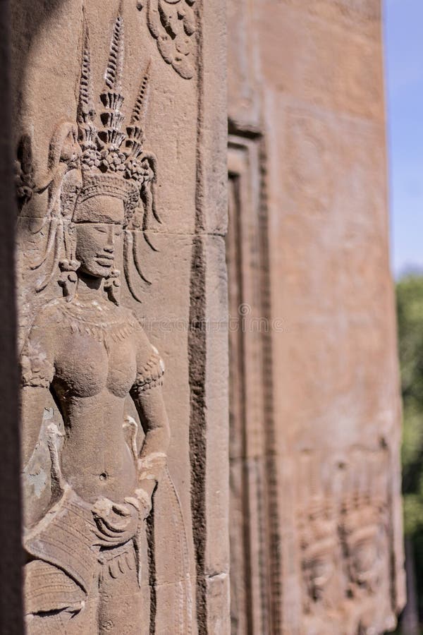 Beauty Dancing Apsaras an old Khmer art sand stone carving of Apsara status on the wall at world heritage, Siem Reap, Cambodia. stock photo Beauty Dancing Apsaras an old Khmer art sand stone carving of Apsara status on the wall at world heritage, Siem Reap, Cambodia. stock photo