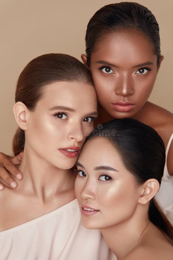 Beauty. Diverse Models Portrait. Tender Caucasian, Asian And Mixed Race Women Posing Together On Beige Background.