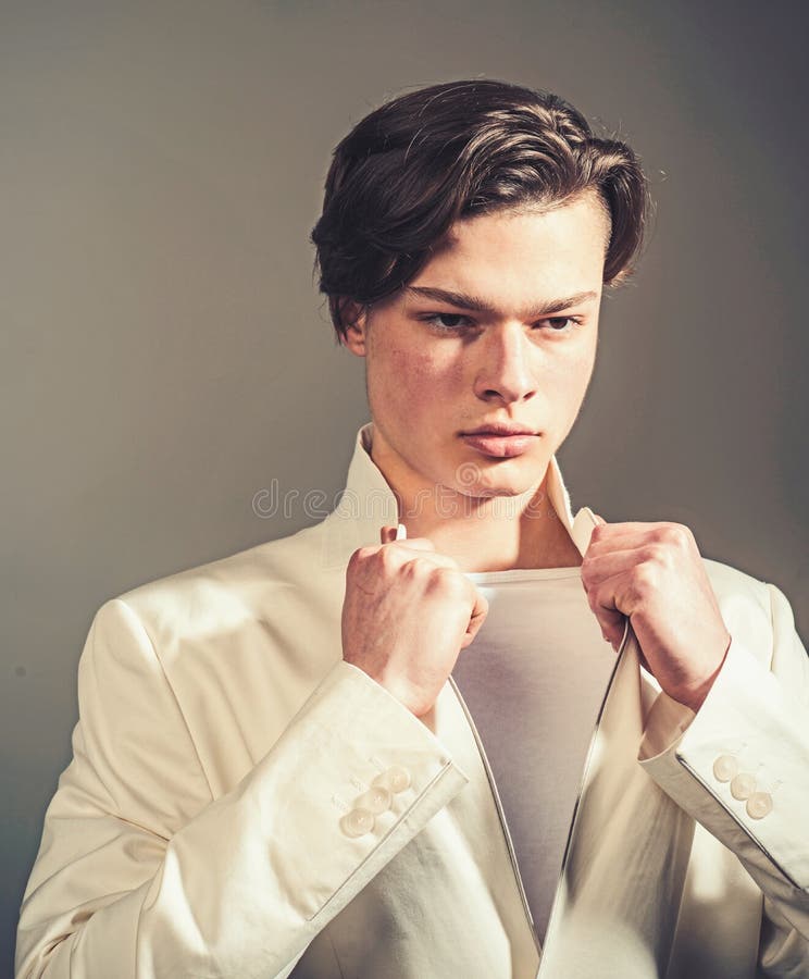Beauty and fashion. Hair style and skincare. Man with trendy look. Fashion man with mystery look. Modern male. Facial royalty free stock photos Beauty and fashion. Hair style and skincare. Man with trendy look. Fashion man with mystery look. Modern male. Facial royalty free stock photos