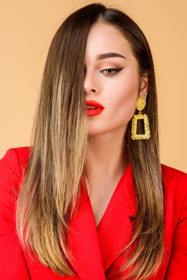 Beauty and fashion. jewelry earrings. Girl in red jacket. hair beauty and hairdresser salon. Fashion portrait of elegant woman. Sexy woman with professional makeup. Young and carefree.