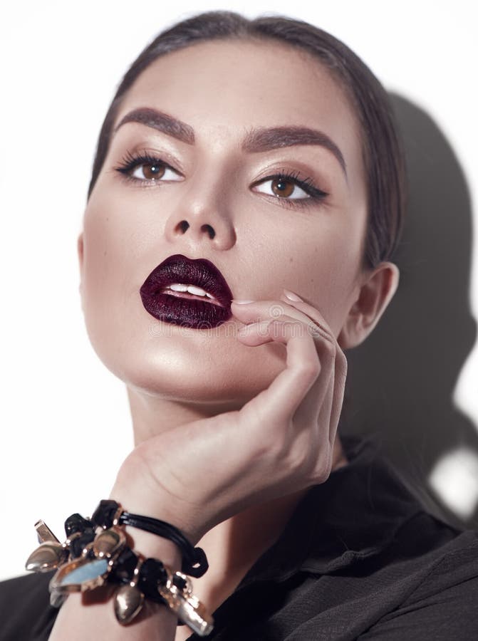 Beauty Fashion model girl with dark lips portrait, wearing stylish sexy woman portrait with perfect makeup