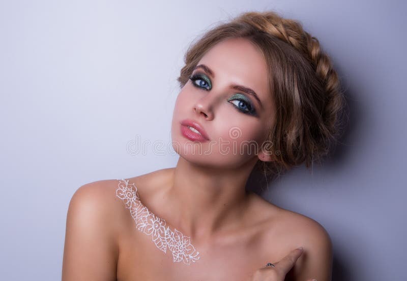 Beauty Fashion Model Woman , portrait, hairstyle with braids. Mehndi , white henna tattoo on shoulders. royalty free stock image Beauty Fashion Model Woman , portrait, hairstyle with braids. Mehndi , white henna tattoo on shoulders. royalty free stock image