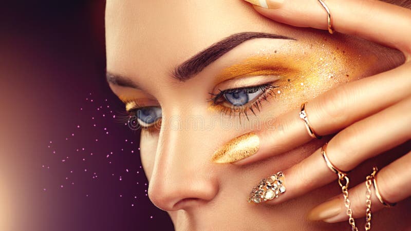 Beauty fashion woman with golden makeup