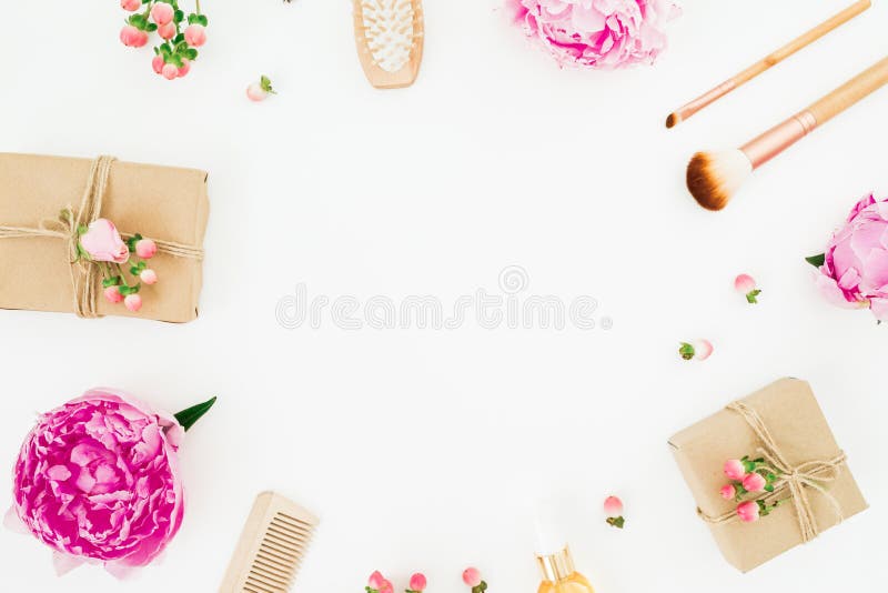 Beauty frame composition of peony flowers with hairbrush, tassel and gifts on white background royalty free stock photo Beauty frame composition of peony flowers with hairbrush, tassel and gifts on white background royalty free stock photo