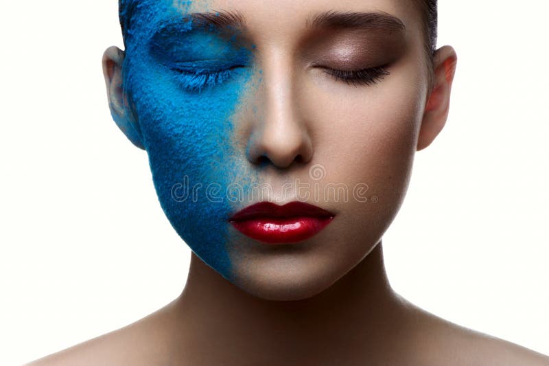 Beauty girl with blue face and red lips stock photography Beauty girl with blue face and red lips stock photography