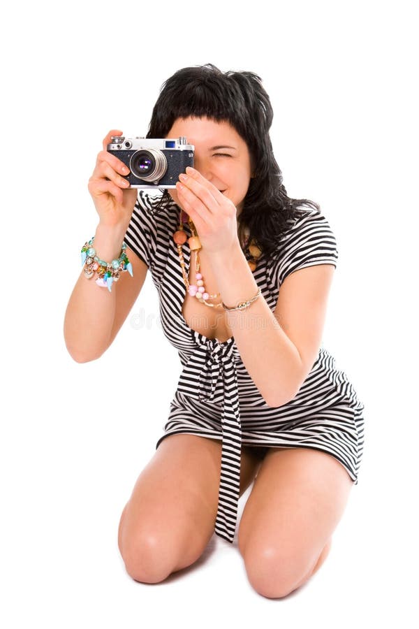 Beauty girl photographer in sailor s vest with photo camera