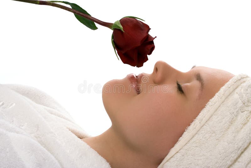 Beauty girl in towel with rose after shower