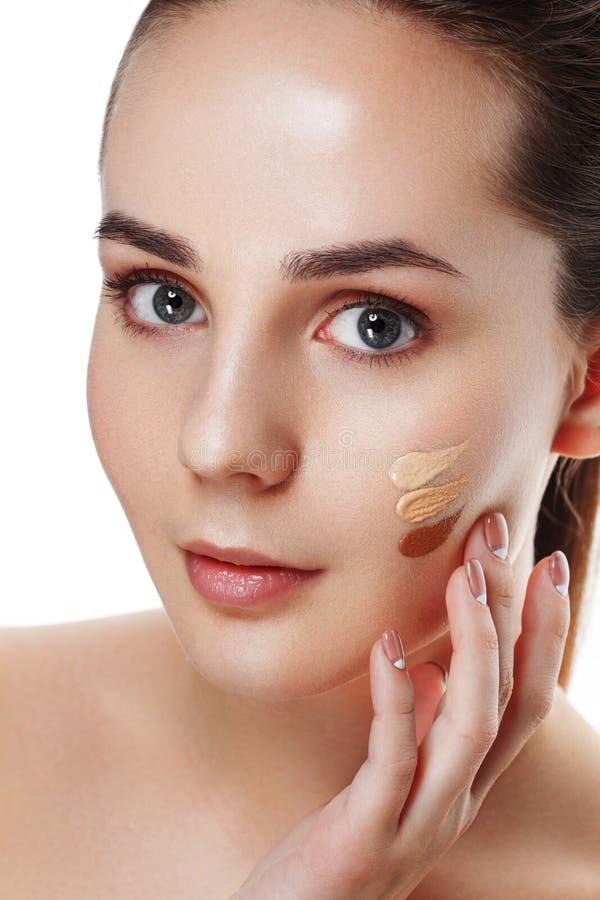Beauty Girl Try to Different tones of Foundation Concealer. Natural Makeup for Brunette Woman with Beautiful Face. Makeover. Per stock image Beauty Girl Try to Different tones of Foundation Concealer. Natural Makeup for Brunette Woman with Beautiful Face. Makeover. Per stock image