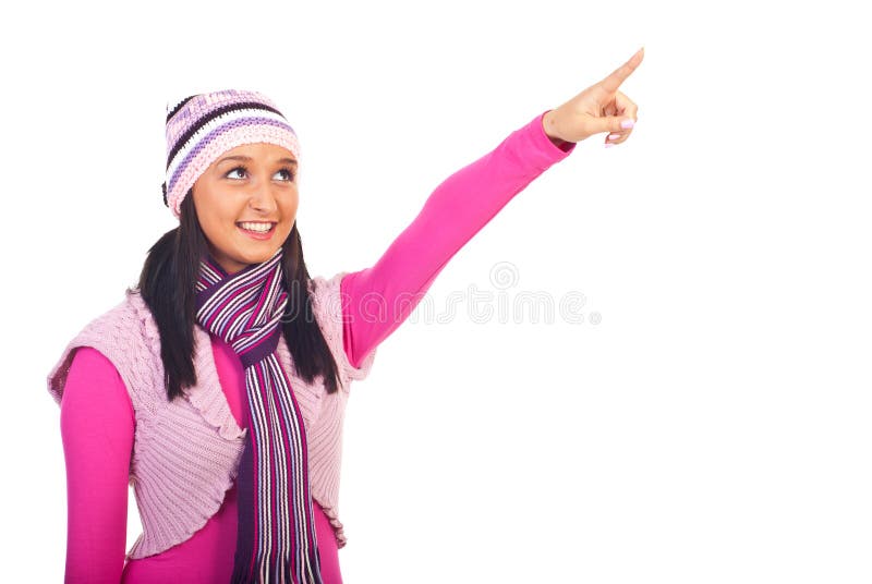 Beauty young woman in pink winter clothes pointing up to copy space isolated on white background. Winter woolen clothes stock images, royalty-free photos and pictures