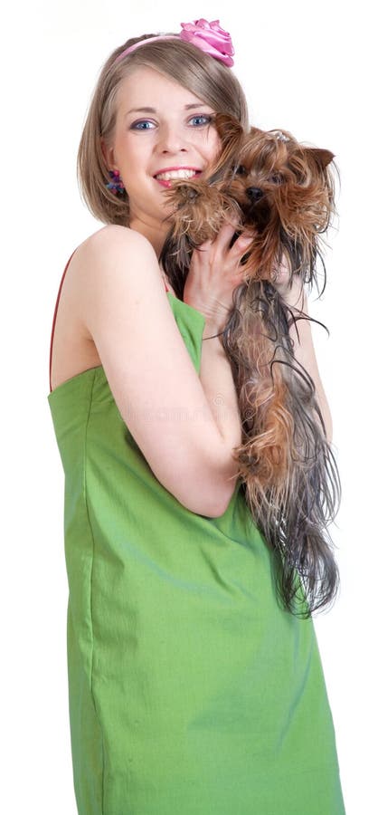 Beauty happy young woman in green dress with dog