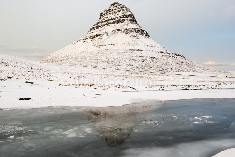Beauty Kirkjufell Mountain With Water Reflection At Winter Iceland