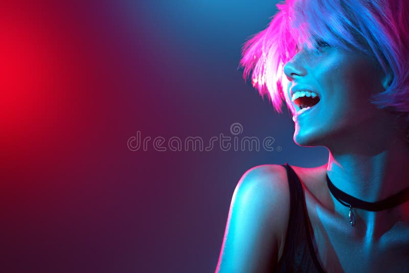 Beauty model girl in colorful bright lights with trendy makeup royalty free stock photography Beauty model girl in colorful bright lights with trendy makeup royalty free stock photography