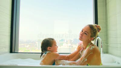 mom daughter bath 