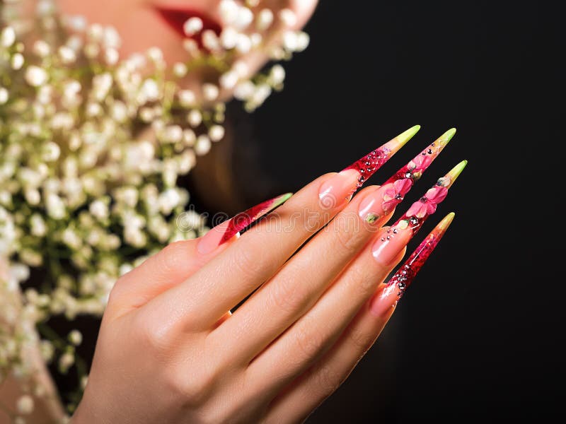 Beautiful girl with bright fashion make-up, creative hairstyle, long nails.  Design manicure. Beauty face. Picture taken in the studio Stock Photo -  Alamy