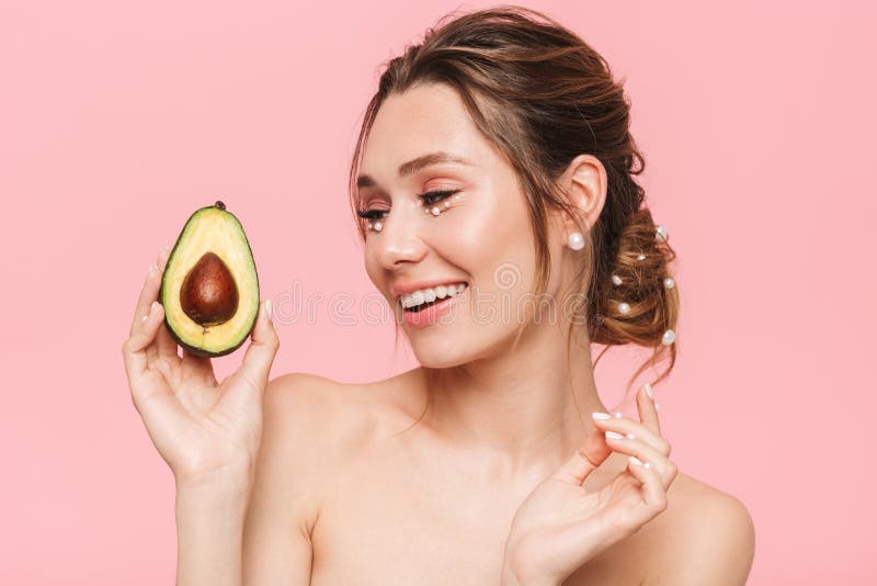 Positive Young Woman Holding Avocado Stock Photo - Image of model ...