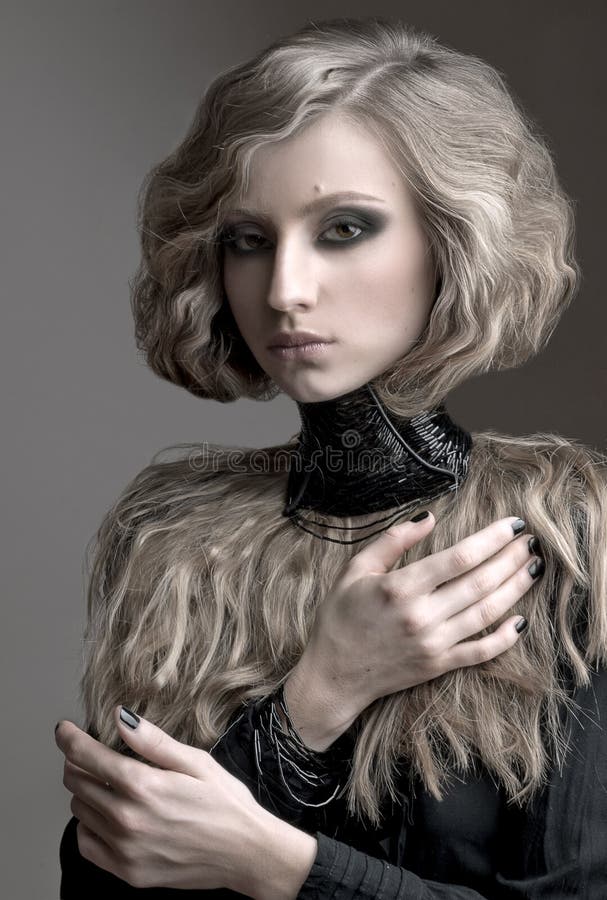 Beauty portrait of blond woman with curly hair, and evening make up stock images Beauty portrait of blond woman with curly hair, and evening make up stock images
