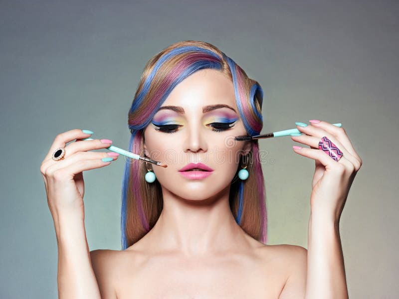 Beautiful Girl with colorful Hair,Applying Make-up stock images Beautiful Girl with colorful Hair,Applying Make-up stock images