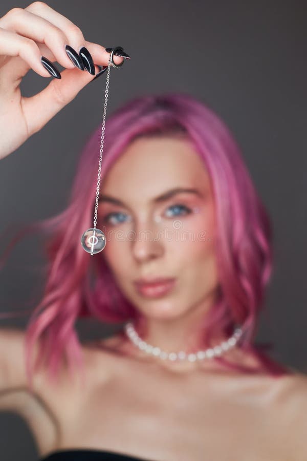 Beauty portrait woman with pink hair, creative vivid coloring. Bright colored highlights and shadows color on the face, a girl stock photos Beauty portrait woman with pink hair, creative vivid coloring. Bright colored highlights and shadows color on the face, a girl stock photos