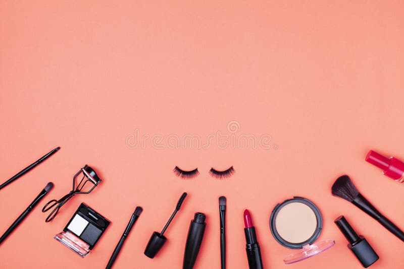 Beauty products and cosmetic for woman makeup on coral table top view. Flat lay style royalty free stock image Beauty products and cosmetic for woman makeup on coral table top view. Flat lay style royalty free stock image