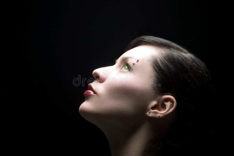 Beauty lady with green eyes on black background. Beauty lady with green eyes on black background