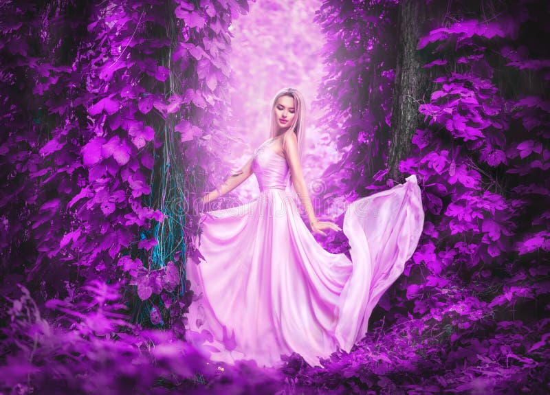 Beauty romantic young woman in long chiffon dress with gown posing in fantasy misty forest. Beautiful happy bride model girl stock image Beauty romantic young woman in long chiffon dress with gown posing in fantasy misty forest. Beautiful happy bride model girl stock image
