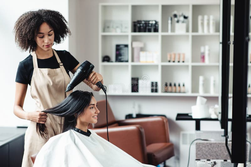 African American Hairdresser Drying Hair of Young Customer Stock Image -  Image of caucasian, fashion: 193710705