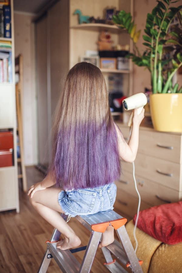 Beauty salon at home. First hair dye experience. Girl power. Cute girl with gradient coloring hair effect