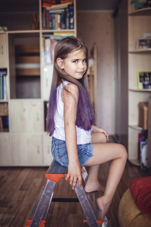 Beauty salon at home. First hair dye experience. Girl power. Cute girl with gradient coloring hair effect