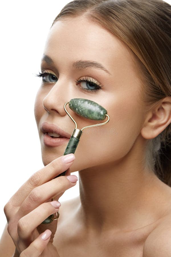 Beauty Skin Care Woman Using Jade Facial Roller For Face Massage Girl Using Natural Massager