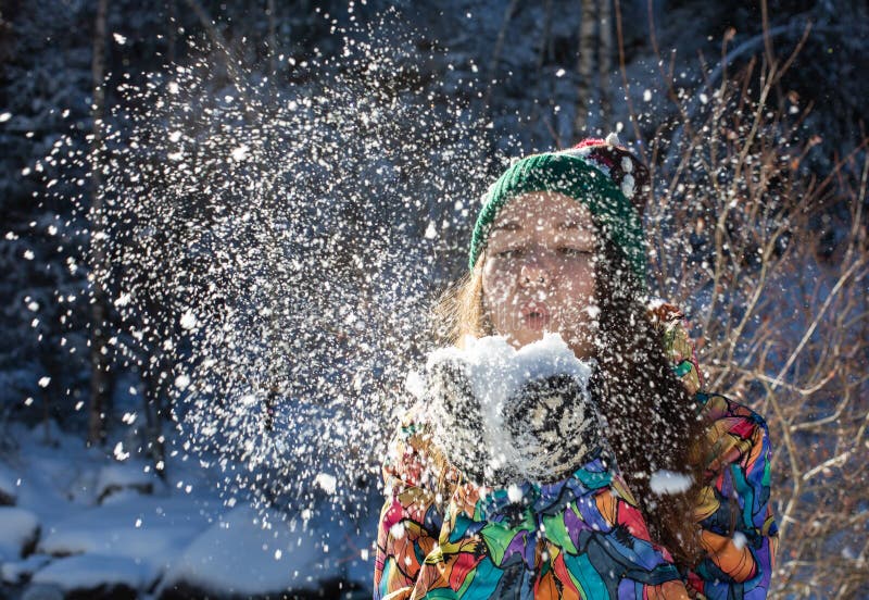 Beauty Winter Girl Blowing Snow in Frosty Winter Park. Outdoors. Flying ...