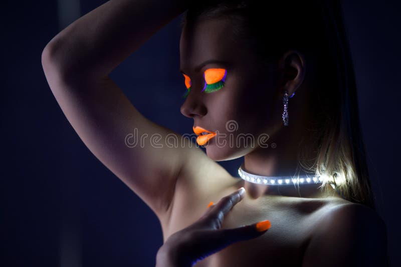 Beauty woman dance with glow make-up