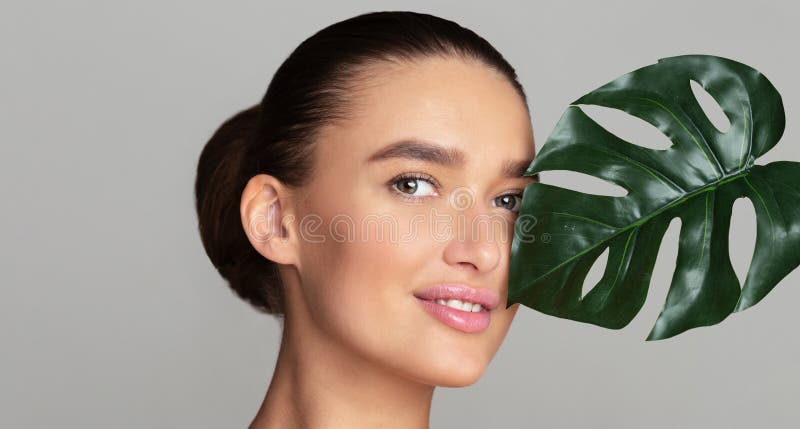 Beauty woman with natural green palm leaf royalty free stock photo Beauty woman with natural green palm leaf royalty free stock photo