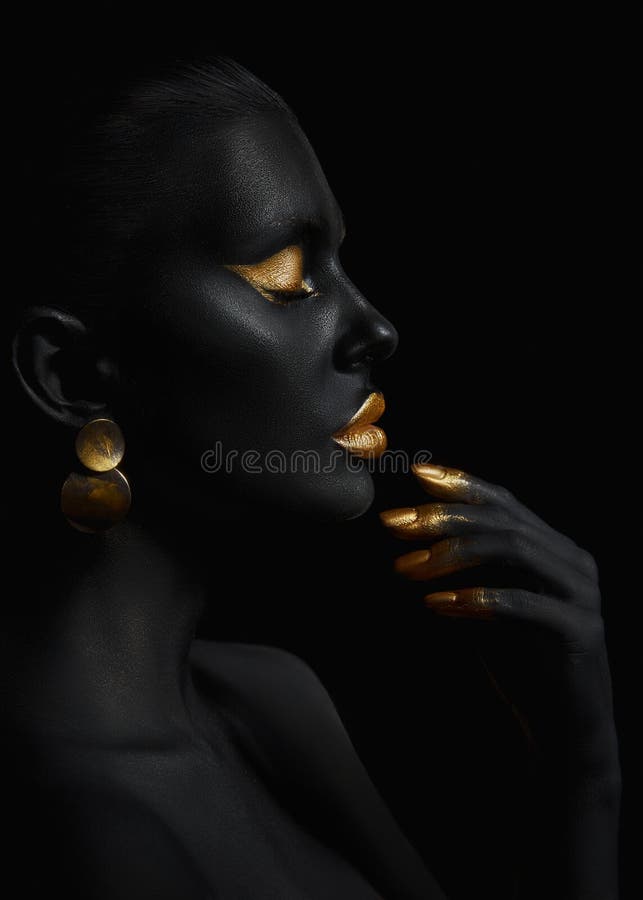 Beauty Woman Painted In Black Skin Color Body Art Gold Makeup Lips Eyelids Fingertips Nails In