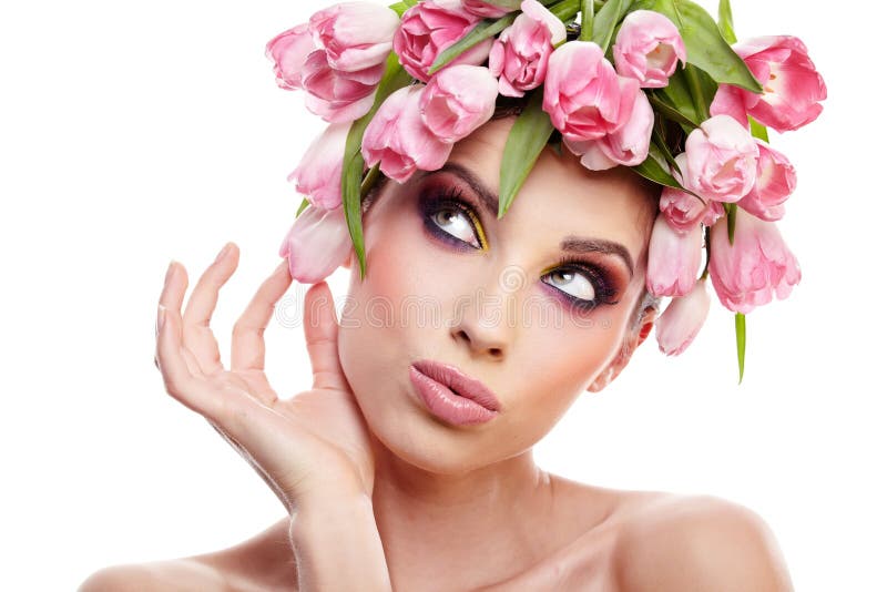 Beauty woman portrait with wreath from flowers on head over whit