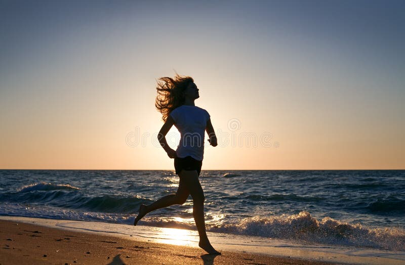 Beauty woman run on sea beach