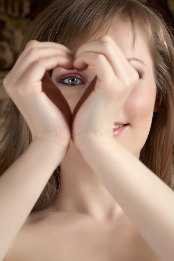 Beauty woman showing heart