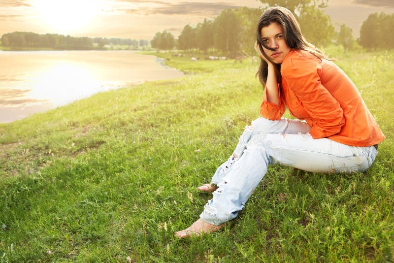 Beauty woman sit on grass