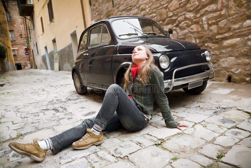 Beauty Woman Sitting Against Retro Car