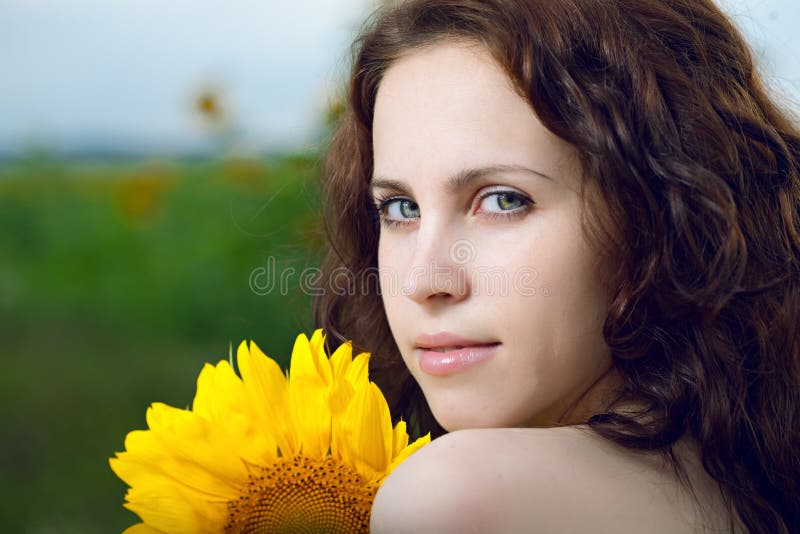 Beauty woman in sunflower