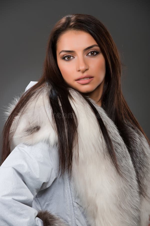 Marvelous Blonde Woman With Birthmark On Face In White Fur Coat On