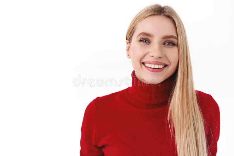 Beauty, women and fashion concept. Cheerful attractive blonde woman with long hair, red turtleneck, smiling with pleased royalty free stock images Beauty, women and fashion concept. Cheerful attractive blonde woman with long hair, red turtleneck, smiling with pleased royalty free stock images
