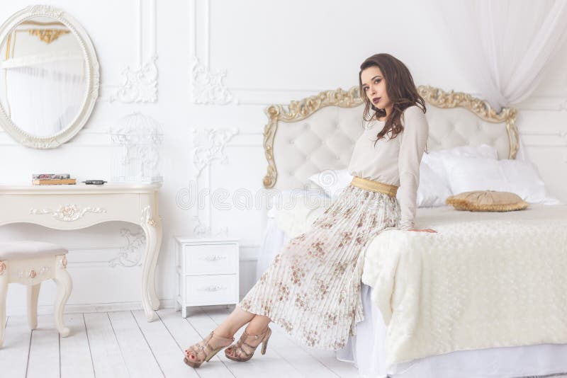 Beauty young brunette woman in luxury home interior, fairy bedroom stock image Beauty young brunette woman in luxury home interior, fairy bedroom stock image