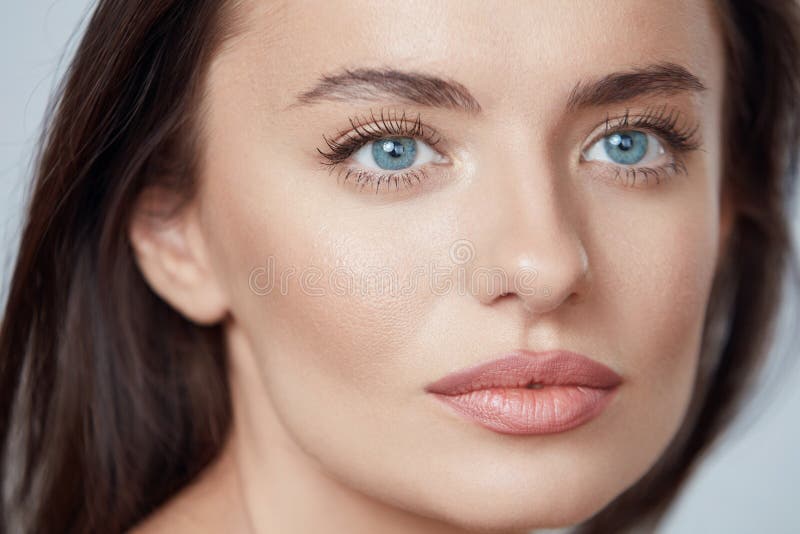 Beauty. Young Woman Close Up Portrait. Beautiful Blue-Eyed Model With Perfect Skin And Natural Daily Makeup.