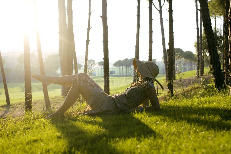 Download Beauty Young Woman On Golf Fiel Relaxing Stock Image - Image of dress, green: 35414833