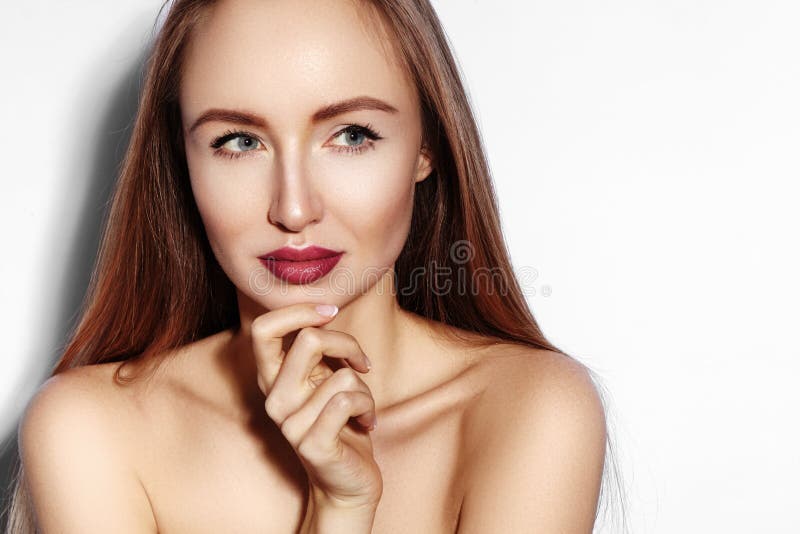 Beauty young Woman on white. Beautiful Model Girl with Makeup, Red Lips, Perfect Fresh Skin. Flirting Expressive Face