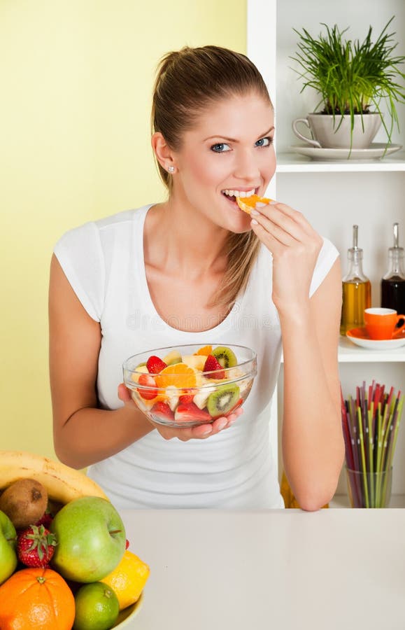 Beauty, young girl eating fruit-salad