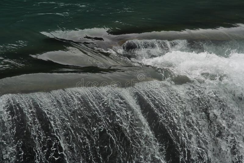 Beautiful steaks and splashes generated by water fall in the rivers in British Columbia where salmon migrates. Beautiful steaks and splashes generated by water fall in the rivers in British Columbia where salmon migrates