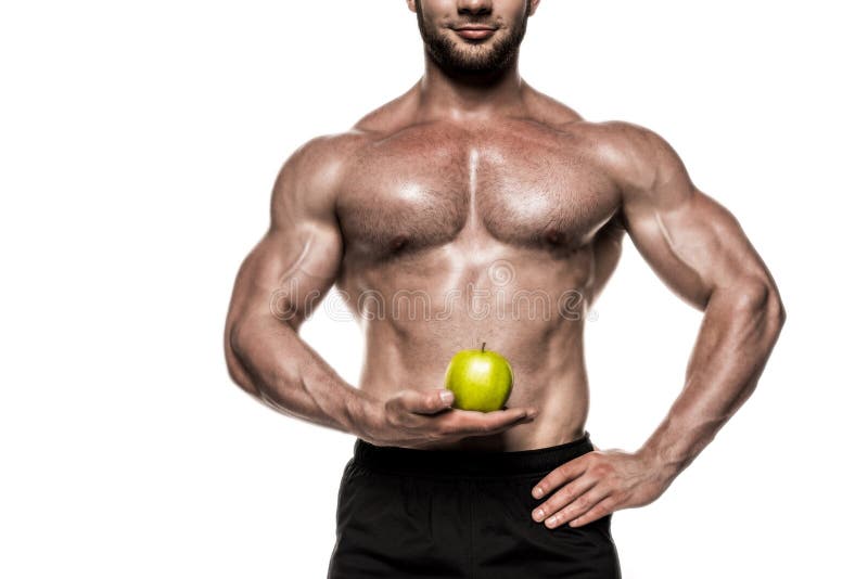 Bebouwde mening van zwetende spiersportman die groene die appel houden op wit wordt geïsoleerd stock foto Bebouwde mening van zwetende spiersportman die groene die appel houden op wit wordt geïsoleerd stock foto
