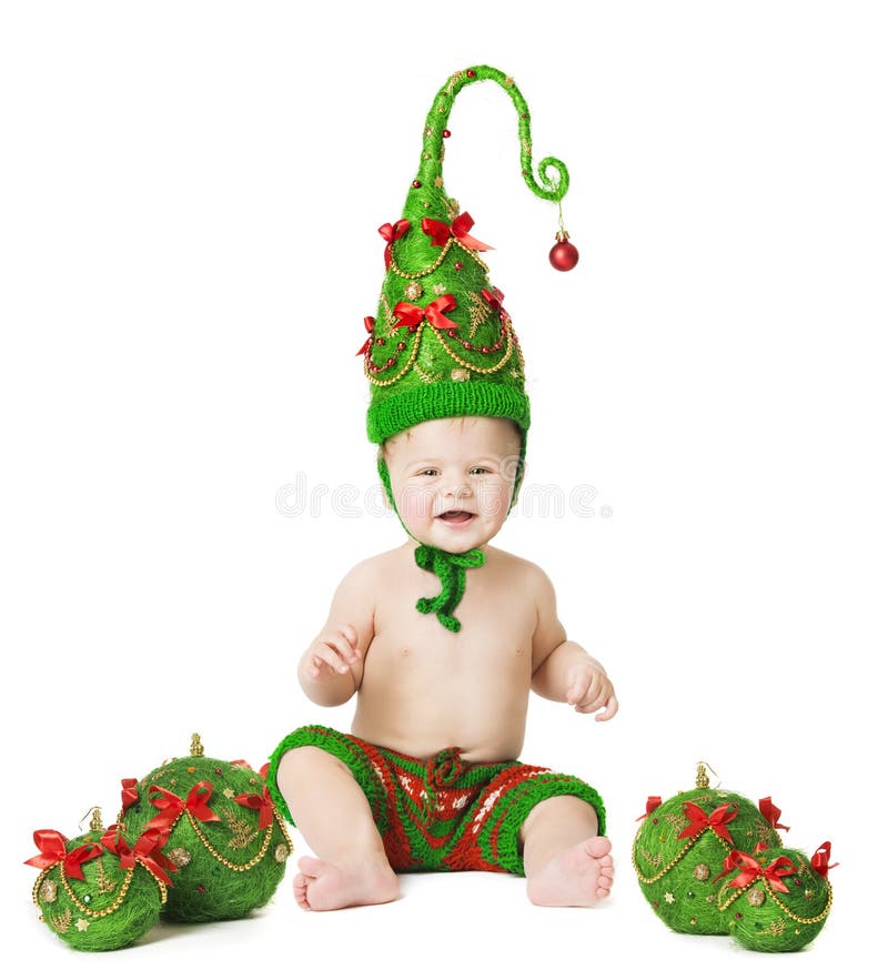 Bebé de la Navidad, sombrero del árbol de Navidad, juguetes de las bolas del niño en Whhite imagen de archivo Bebé de la Navidad, sombrero del árbol de Navidad, juguetes de las bolas del niño en Whhite imagen de archivo
