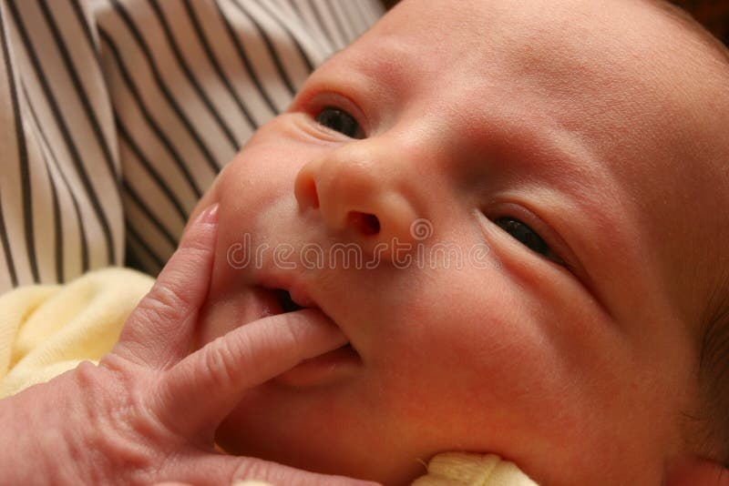 Baby sucking her finger. Baby sucking her finger